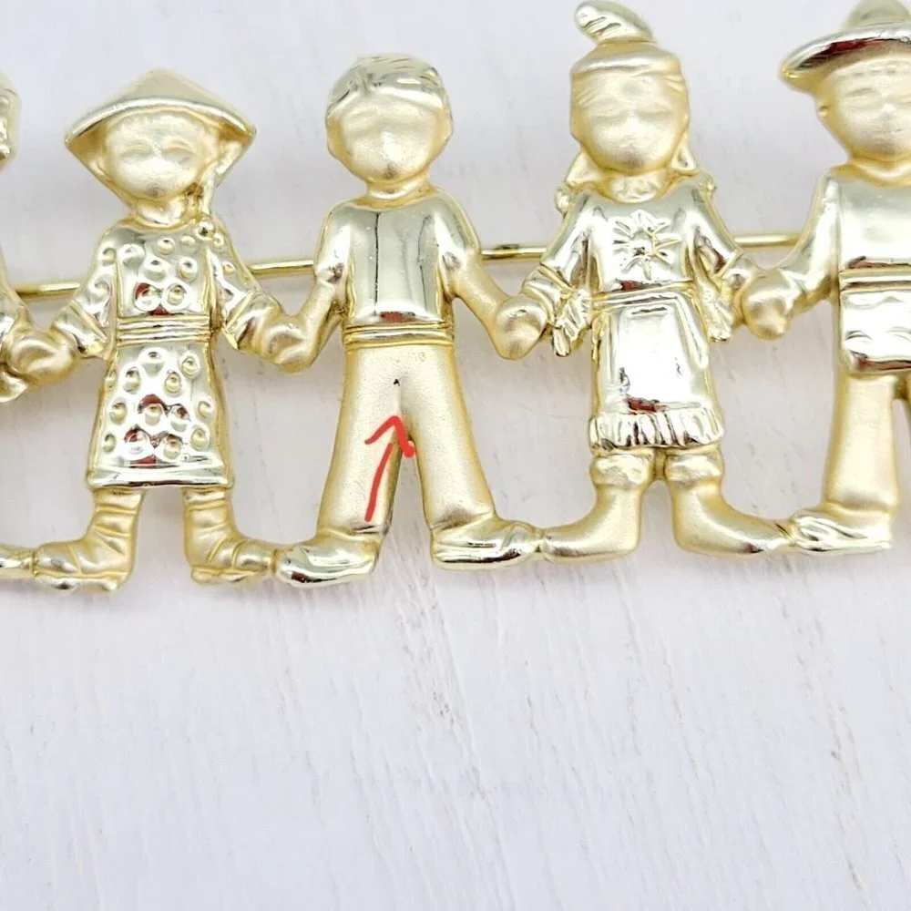 AJC American Jewelry Co. Children Of The World Brooch Satin & Polished Gold Tone